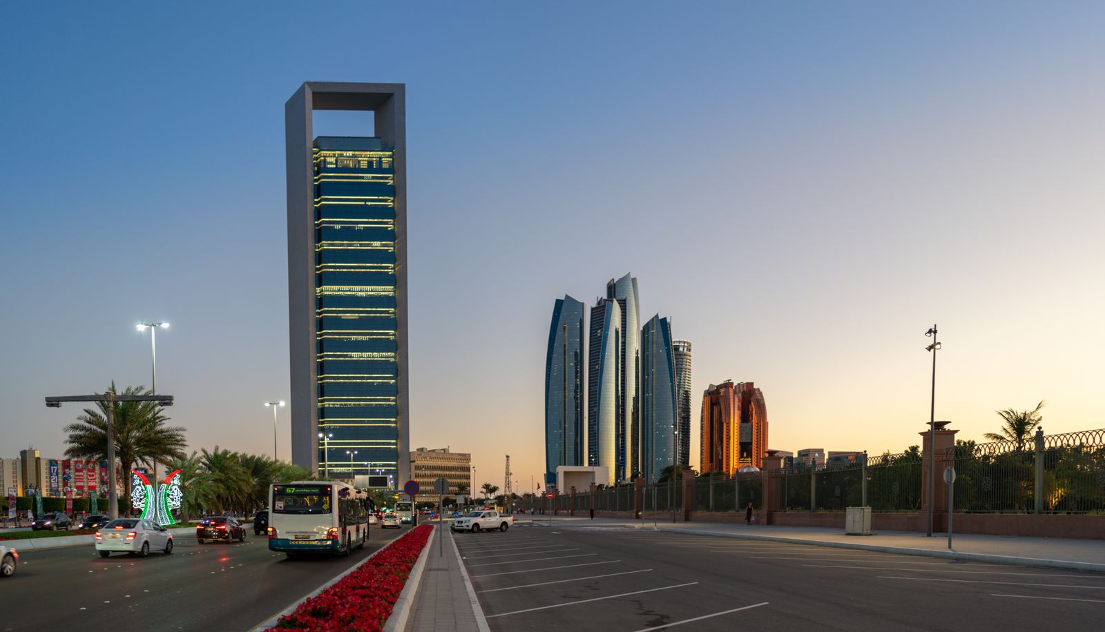Traffic on an Abu Dhabi road at sunset, a reminder why transport plans for UAE events need buffers