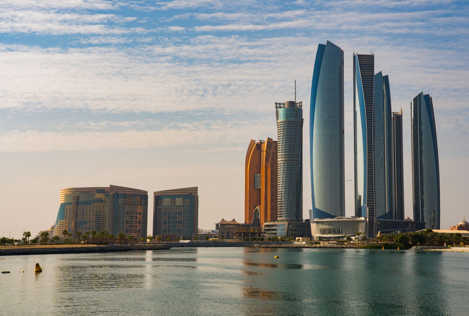 Abu Dhabi skyline across the water on a clear day, the setting for the capital’s busy event season