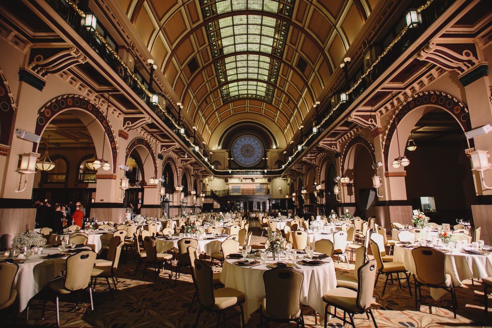 Ballroom set with round tables for a gala dinner, where planning ushers per guest starts with table zones