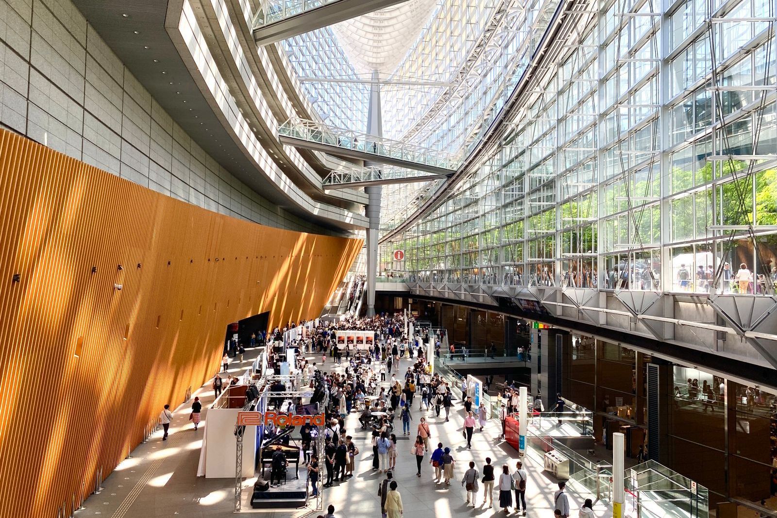 Visitors in a busy convention centre concourse, the kind of show week exhibition staff in Abu Dhabi plan for