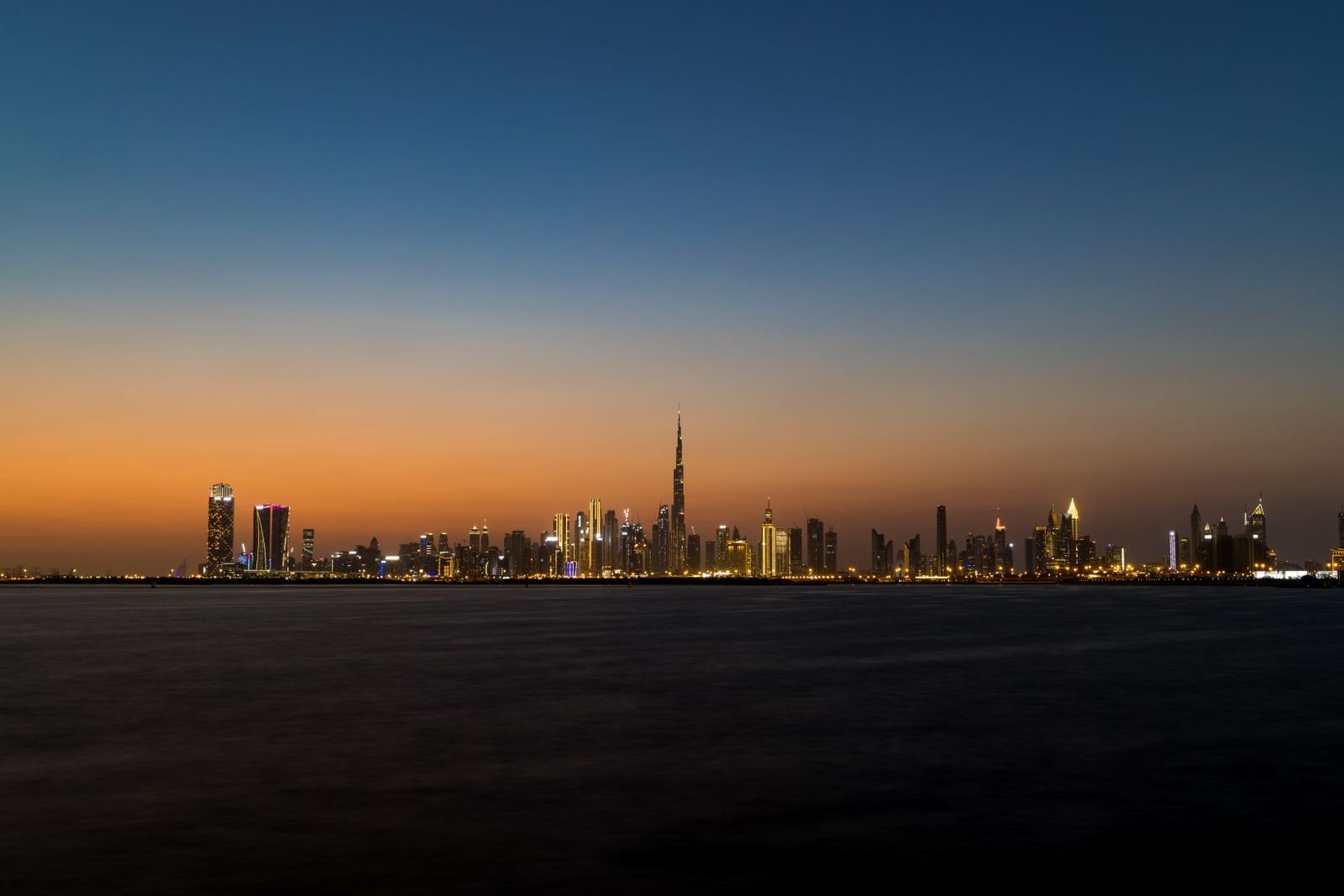 Dubai skyline at dusk across the water, where choosing a crew supplier starts