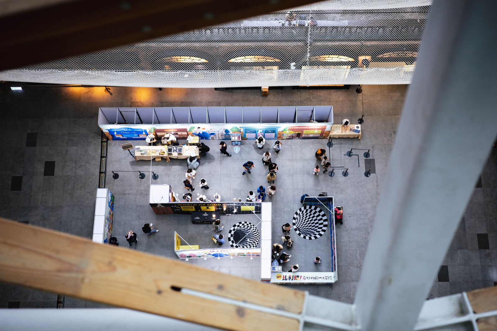 Busy exhibition hall seen from an upper level, the scale GITEX event staff plan for at Expo City Dubai