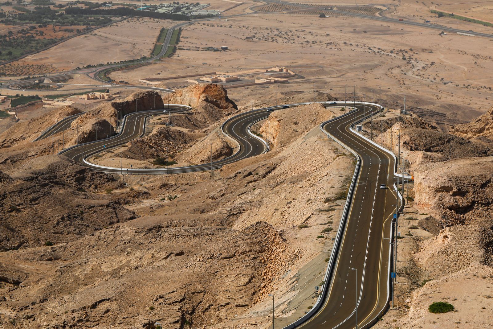 Road winding up Jebel Hafeet near Al Ain, part of the inland landscape behind event staffing in Al Ain