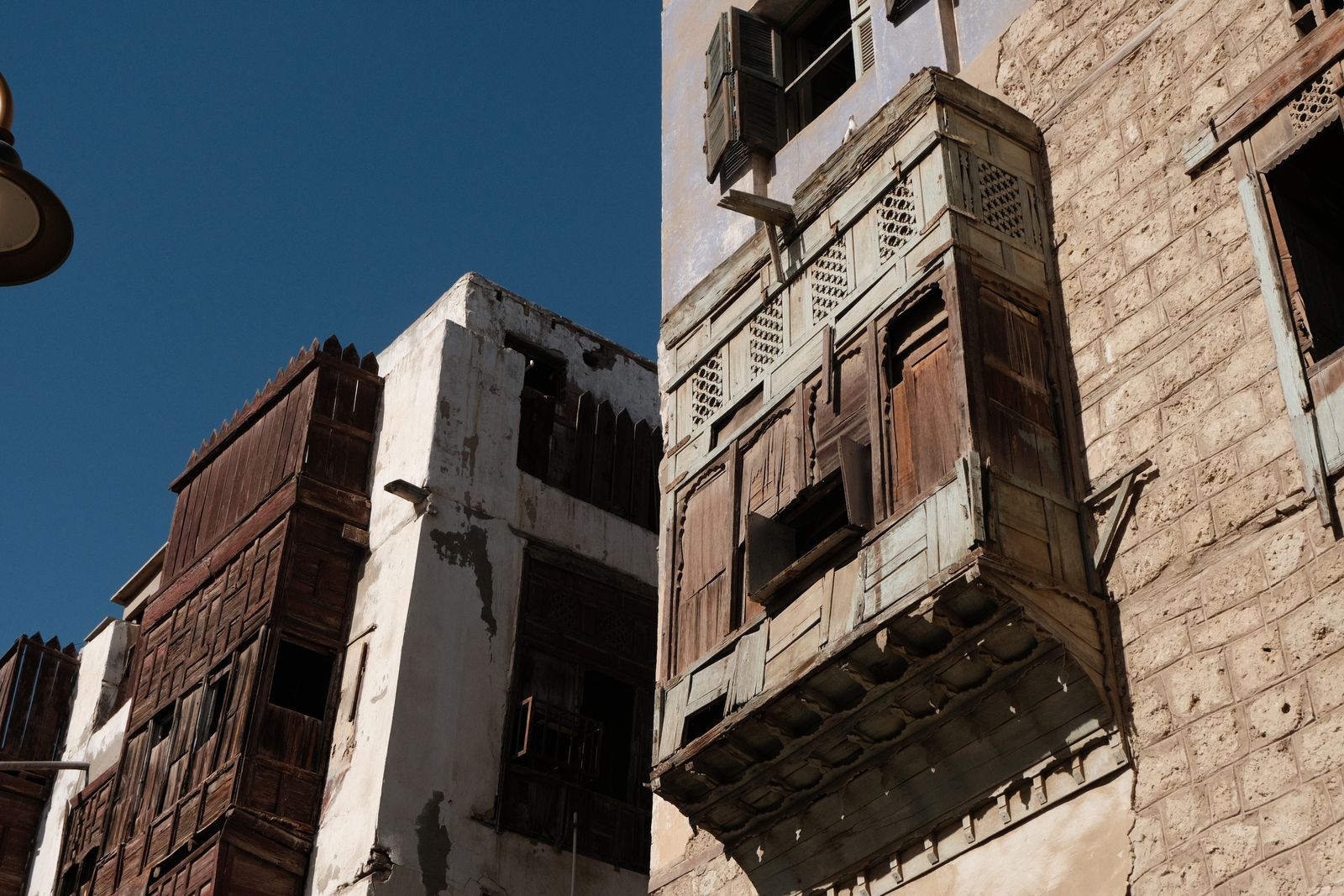 Traditional wooden balconies in Al-Balad, the historic district where event staffing in Jeddah meets heritage settings