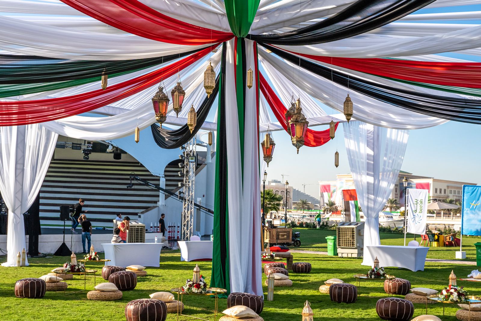 Outdoor event set-up with Emirati-style decor and seating, planned with outdoor event staff in the UAE