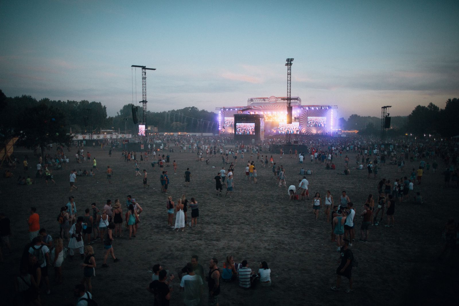 Crowd at an outdoor festival at dusk, where event security staff in the UAE manage entry and flow