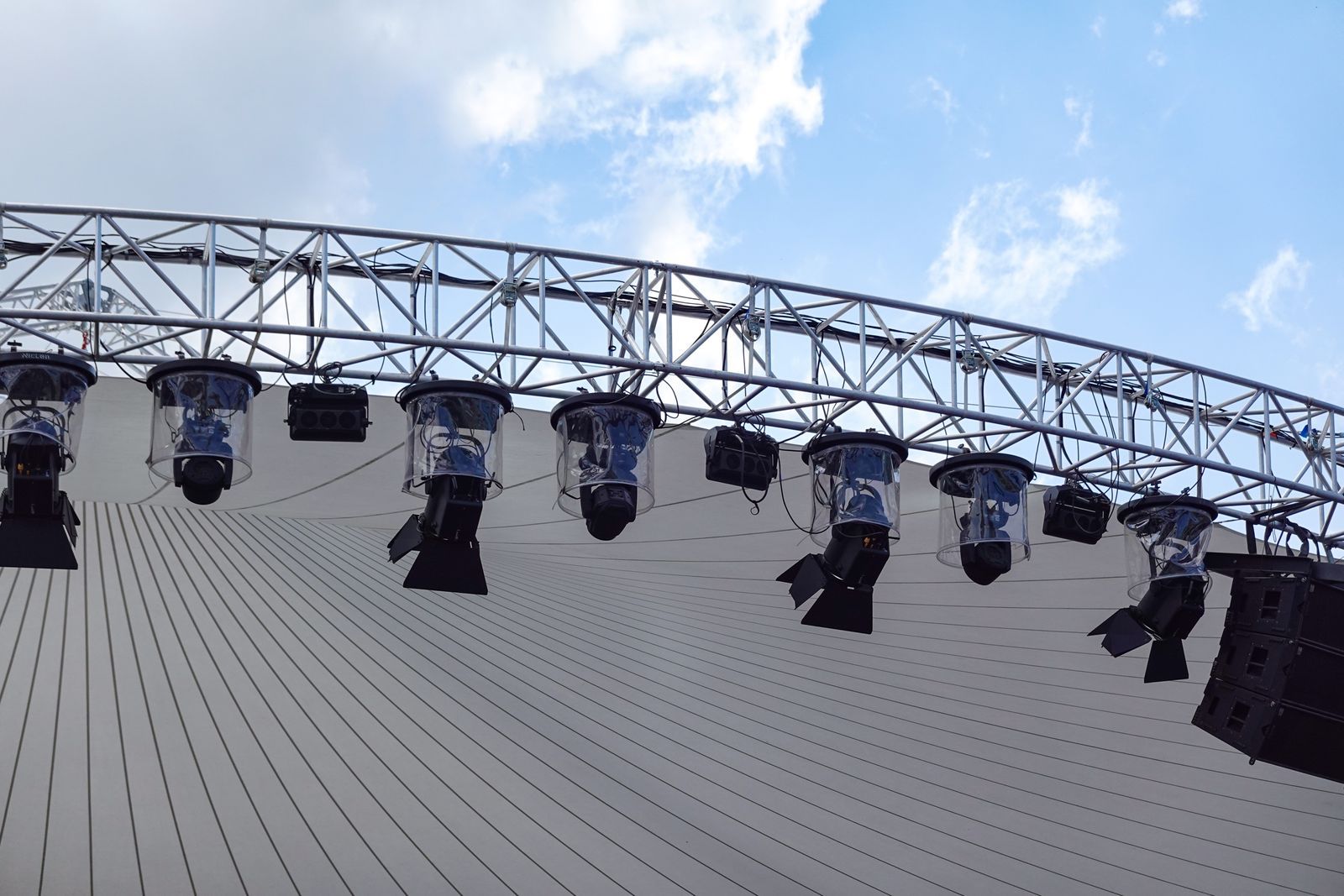 Lighting rig on a stage truss being prepared by event crew in Dubai before a show