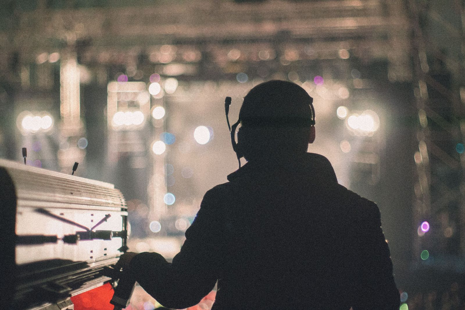Show operator wearing a headset at the control position